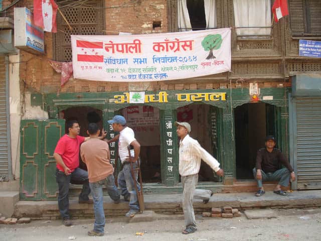 Students relax under a Maoist banner.