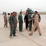Iraqi Air Force airmen rejoice after four new MI17 helicopters arrived on Camp