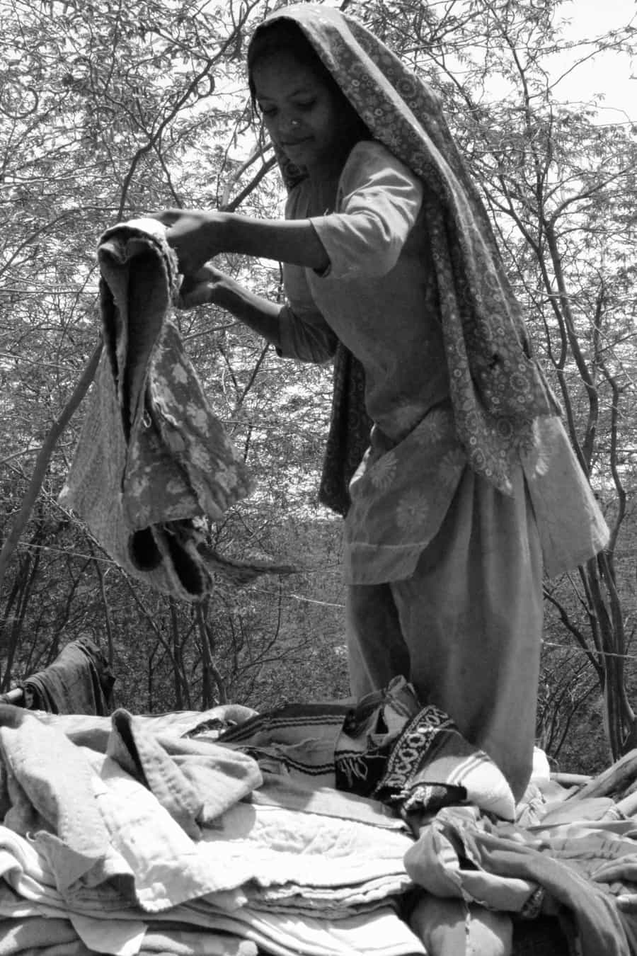 A Pakistani Hindu Refugee Woman Carries Water in a Pot on Her He
