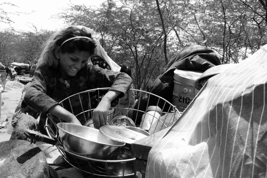A Pakistani Hindu Refugee Woman Carries Water in a Pot on Her He