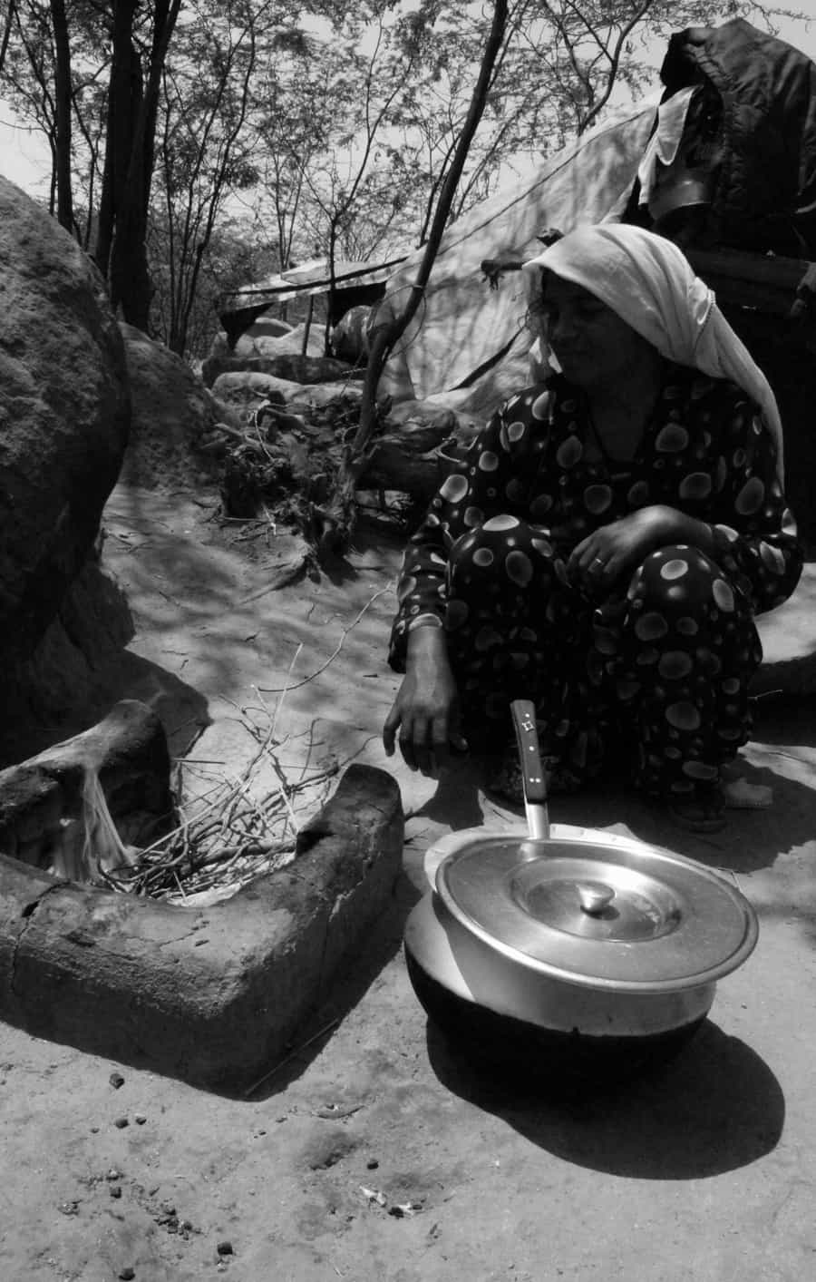 A Pakistani Hindu Refugee Woman Carries Water in a Pot on Her He
