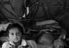 Two Pakistani Hindu Refugee Children Play Inside A Tent