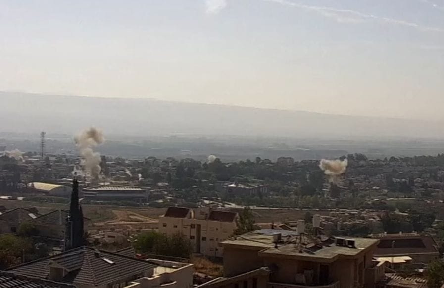 hezbollah rocket explosions in north israel. youtube CC screenshot.