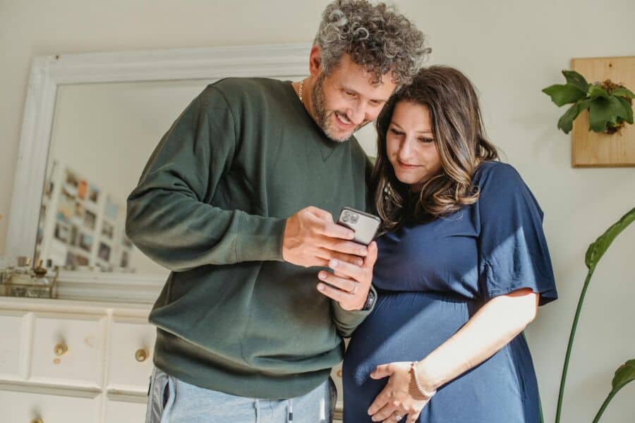 This Video Marketing Platform Is Going Viral, Here Is Why 1 Adults watching on smartphone at home