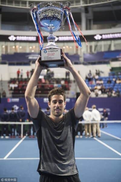 man holding a trophy