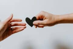 Heart exchange symbolizes emotional support and mental well-being during holiday stress.