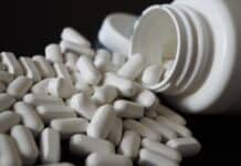 2026’s IBD Remedies: The 5 Treatments Rewriting The Rules Of Remission bottle of white pills
