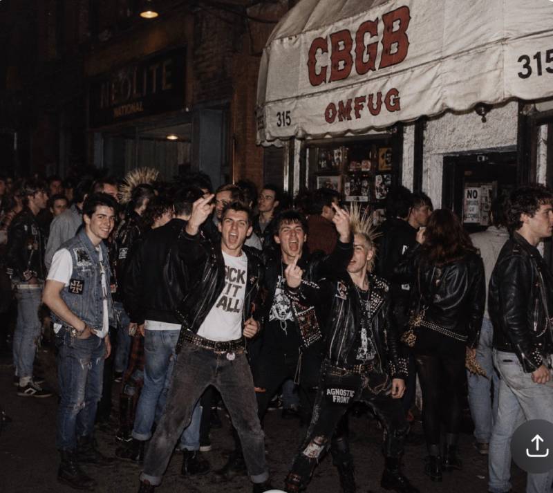 Scene of punk and hardcore fans outside CBGB on the Bowery in New York City