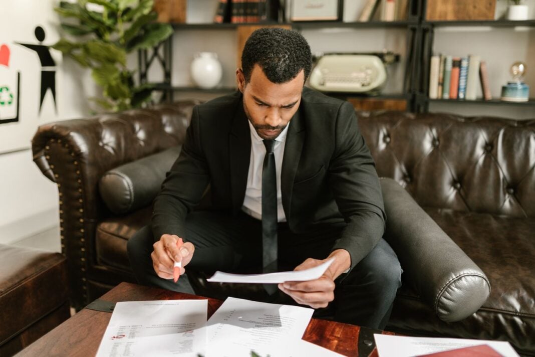 Photo by RDNE Stock project: https://www.pexels.com/photo/man-sitting-on-brown-leather-sofa-looking-at-documents-7821536/