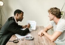 Insurance Company Tactics That Can Affect Settlements Photo by RDNE Stock project: https://www.pexels.com/photo/an-agent-showing-documents-to-his-client-7821671/