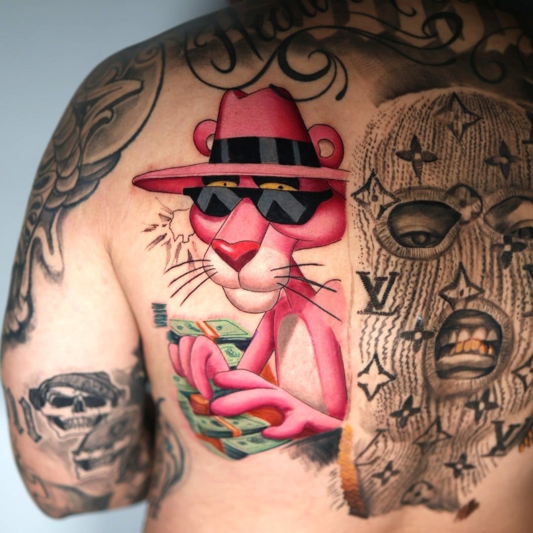 Custom color realist back piece of the Pink Panther by tattoo by Natacha Rios
