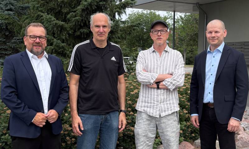 Dacke Industri and Electromen Oy representatives standing together after Dacke Industri acquired 80% of the Finnish electronic control systems company. Electromen acquisition.